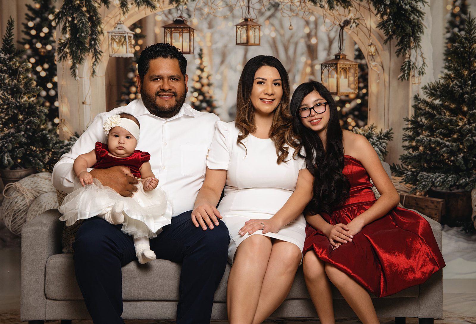 Holiday family photo with christmas wonderland background.